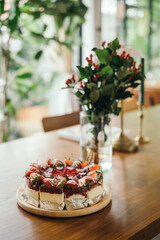 Red Velvet Cake on rustic cafe table with blur background 