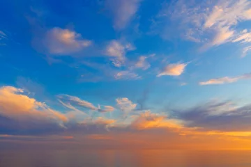 Foto op Plexiglas Beautiful sunset sky with clouds, the horizon merges with the sea, backgrounds . High quality photo. © svetograph