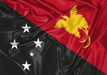 Papua New Guinea flag waving in the wind. National flag on satin cloth surface texture. Background for international concept.