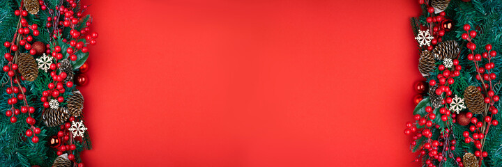 Christmas decorations on the red background with copy space for your text. Banner.