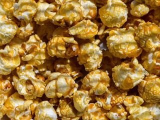 Popcorn with caramel -  food background. Selective focus.