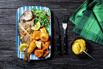 Roasted dorado with potato and wild rocket salad