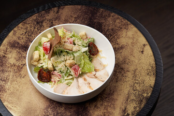 Caesar Salad with grilled chicken breast and parmesan cheese