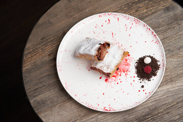 Strawberry biscuit roll with  berry syrup and fromage frais