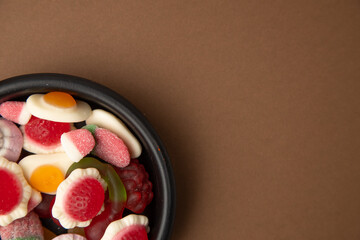 candy, sugar on black bowl