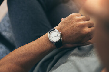 fashionable wearing stylish looking at luxury watch on hand check the time at workplace.concept for...