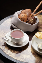 Healthy breakfast set on table with honey, tea, bread