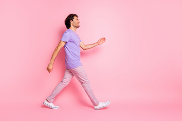 Fototapeta na wymiar Full length portrait of satisfied person walking free time watch empty space magenta shirt isolated on pink color background