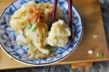Eating Wanton with a pair of Chopsticks