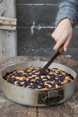 focaccia with red grapes on a blue table. Italian Cuisine, the perfect appetizer