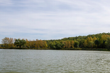 water surface of a forest lake on an autumn day