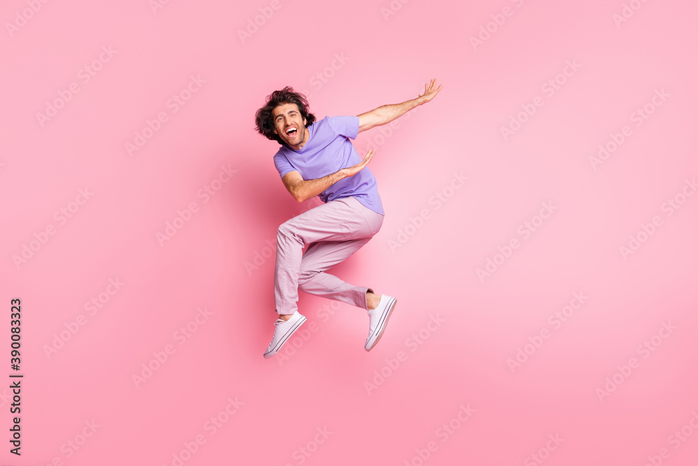 Wall mural Full body photo of joyful active stylish brown haired bristled young man jump air happy sale isolated on shine pink color background