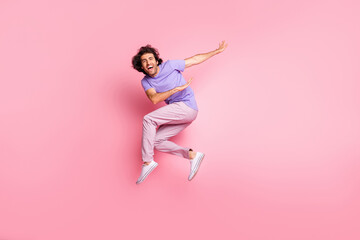 Full body photo of joyful active stylish brown haired bristled young man jump air happy sale...