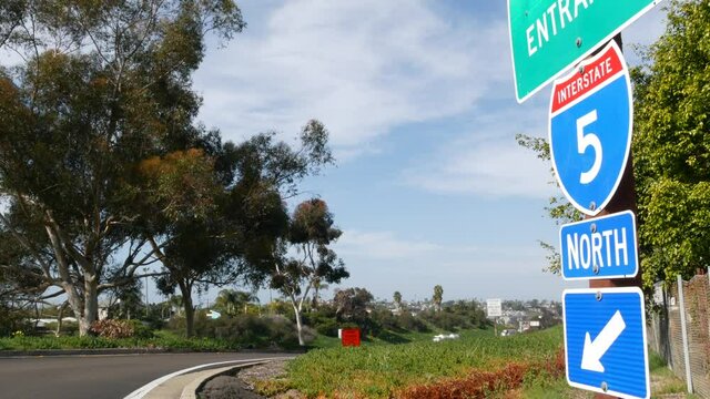 Freeway entrance, information sign on crossraod in USA. Route to Los Angeles, California. Interstate highway 5 signpost as symbol of road trip, transportation and traffic safety rules and regulations.