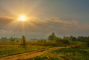 Obraz premium The sun peeps out from behind the clouds. Morning.