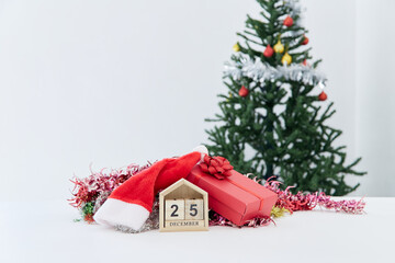 Fototapeta na wymiar Wooden block calendar and decor on the table. Christmas countdown