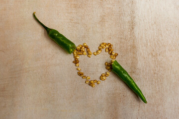 green chili peppers on wood