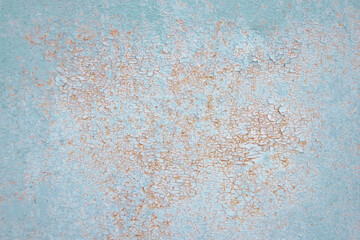 Abstract background orange rust on turquoise painted metal surface. Corroded metal background.