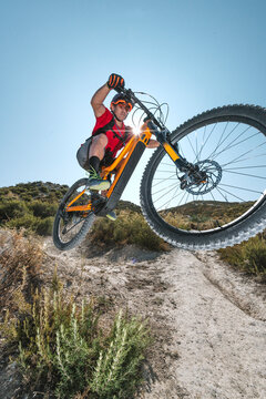 cyclist jumping with electric bike