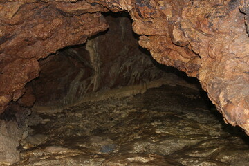 Crimea / Russia. red cave inside. Stalactites and stalagmites