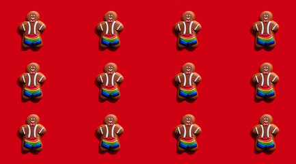 Gay pride. Red seamless background. Black lives matter. Bakery food conceptual decoration. Happy African gingerbread man chocolate cookie in rainbow shorts symmetrical arrangement isolated on bright.