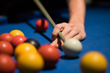 Detail of person playing pool