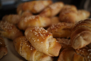 Homemade rolls with cheese and sesame. Idea for breakfast or snack. Delicious and fresh homemade rolls with cheese.