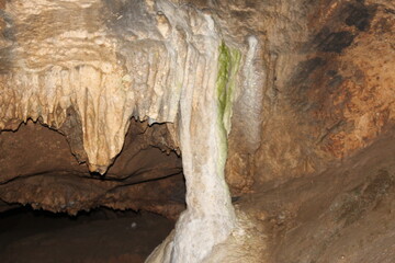 Crimea / Russia. red cave inside. Stalactites and stalagmites