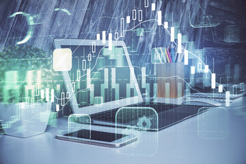 Financial graph colorful drawing and table with computer on background. Multi exposure. Concept of...