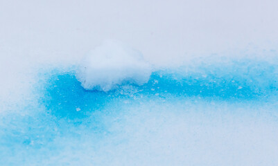 Blue paint on the snow in winter.