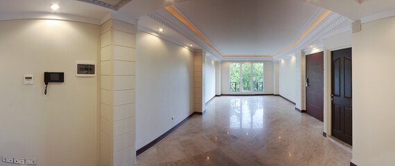 Empty hall of the house with windows