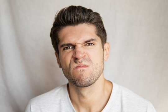 Portrait Of A Young Handsome Man With Pissed Face Expression Being Close To Blow Up