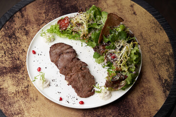 Grilled beef steak with fresh salad. Roasted meat steak