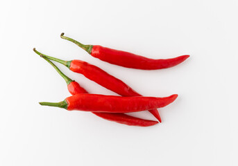 Group Red hot chili peppers arranging with white background. Garnish and food ingredients.