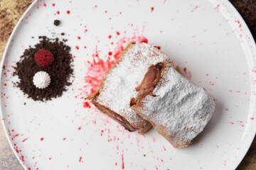 Strawberry biscuit roll with  berry syrup and fromage frais