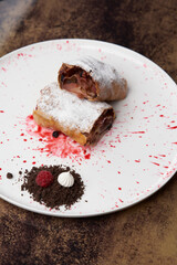 Strawberry biscuit roll with  berry syrup and fromage frais