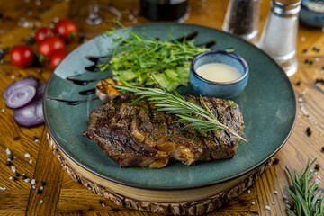 Rib-eye steak with sprig of rosemary
