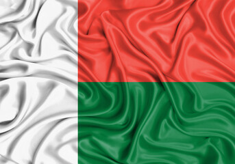Madagascar , national flag on fabric texture waving background.