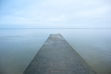 Fototapeta premium Concrete breakwater. Playground, access to the sea.