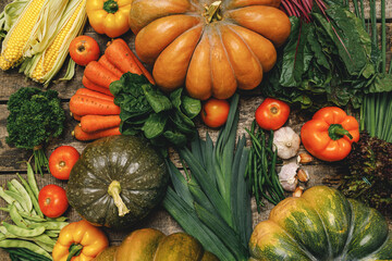Beautiful arrengament of autumn vegetables on wooden table