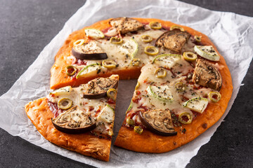 Autumn pumpkin pizza with vegetables on blackboard background