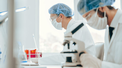 close up. scientist using a microscope in the laboratory.