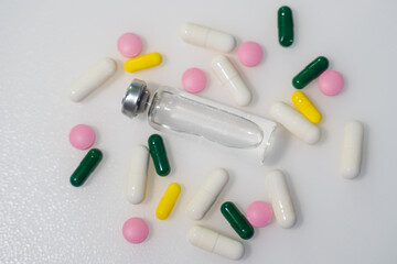 Different pills on color background, flat lay