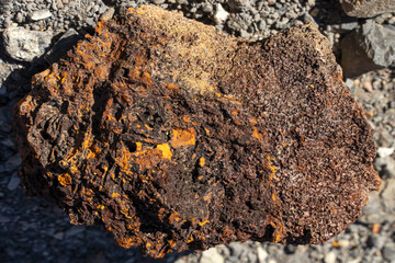 Rough texture of mountain wild stone. Marble. Granite. Stone abstraction. Mountain stone. The rough surface of an ancient mountain. Grunge texture. Laminated surface. Abstract grunge background.
