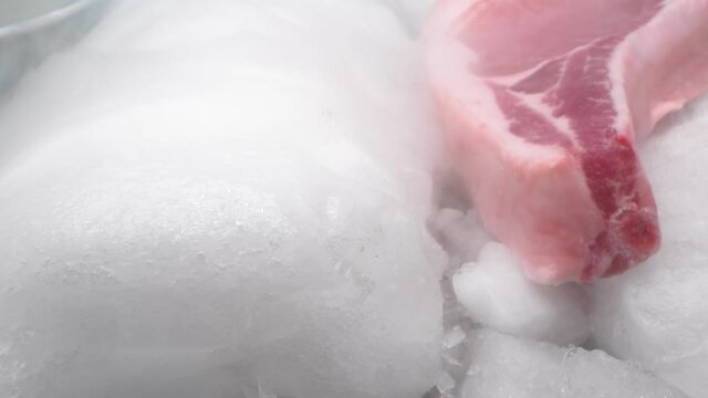extreme close-up, detailed. pork steak on the bone on dry ice with thick white smoke. blue background