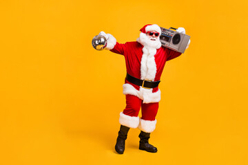 Full length photo of funky santa claus with grey beard hold boom box disco ball x-mas christmas...