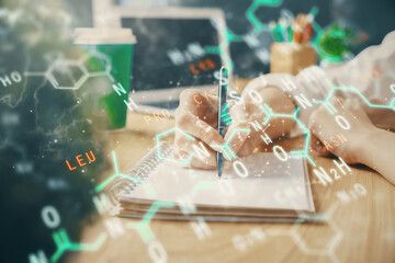 Science formula hologram over woman's hands taking notes background. Concept of study. Double...