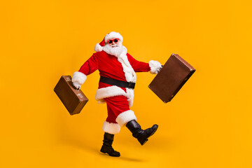 Full body profile side photo of white grey hair bearded santa claus go carry luggage x-mas...