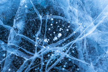 Ice crack texture, Close-up texture surface cracks of the natural ice in frozen water at Baikal lake, Russia.
