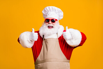 Crazy santa claus with beard in chef headwear cook show thumb up sign x-mas christmas holly jolly...